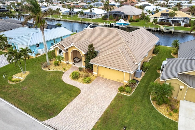 birds eye view of property featuring a water view