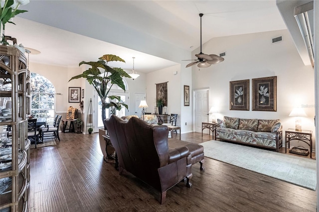 living room with high vaulted ceiling, ceiling fan, and dark hardwood / wood-style floors