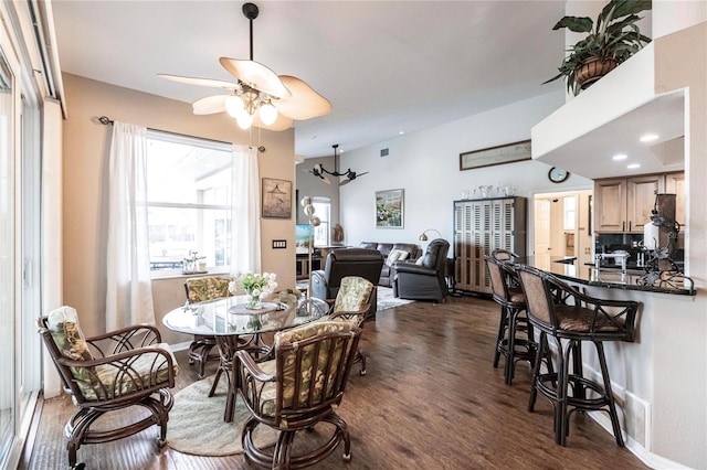 dining area featuring dark hardwood / wood-style flooring and ceiling fan