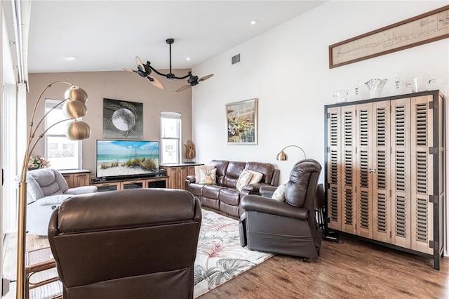 living room with hardwood / wood-style flooring and lofted ceiling