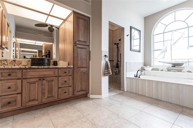 bathroom with vanity, tile patterned floors, and separate shower and tub