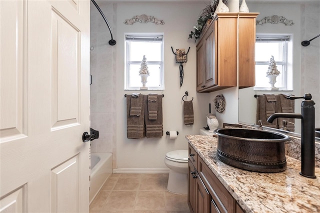 full bathroom with vanity, tile patterned flooring, plenty of natural light, and tiled shower / bath