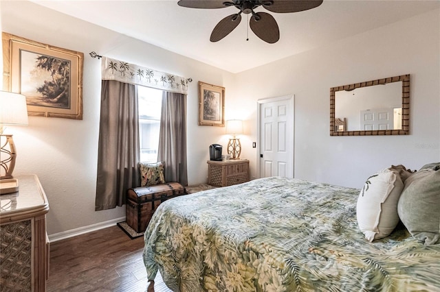 bedroom with ceiling fan and dark hardwood / wood-style floors