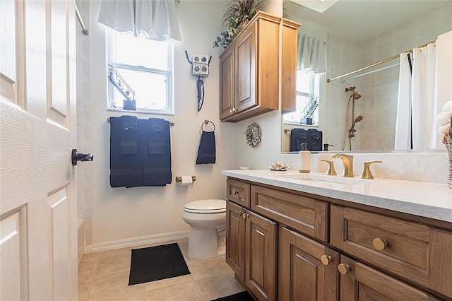 1215 Via Tripoli, Punta Gorda, FL 33950 - bathroom with tile patterned floors, toilet, tiled shower, baseboards, and vanity