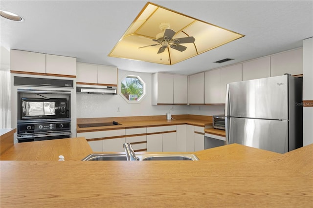 kitchen with white cabinetry, black appliances, sink, and ceiling fan