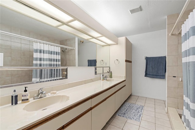 bathroom with vanity, a shower with shower curtain, and tile patterned floors