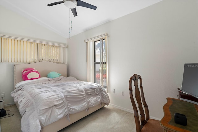 carpeted bedroom featuring lofted ceiling and ceiling fan