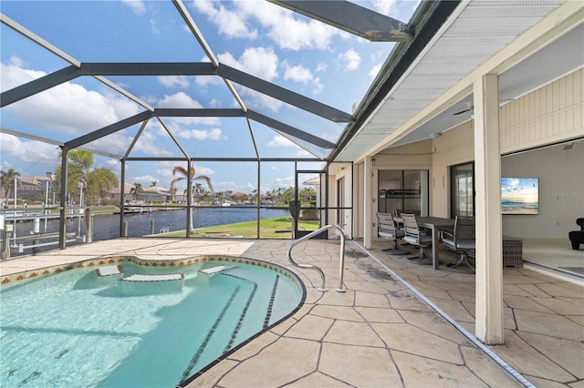 view of swimming pool featuring a water view, a patio area, and glass enclosure