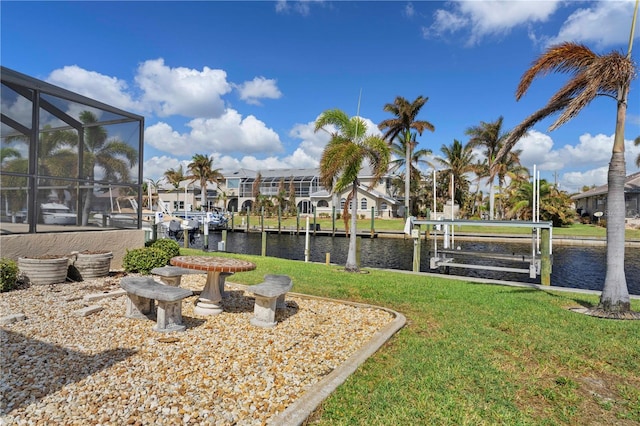 exterior space with a water view and glass enclosure