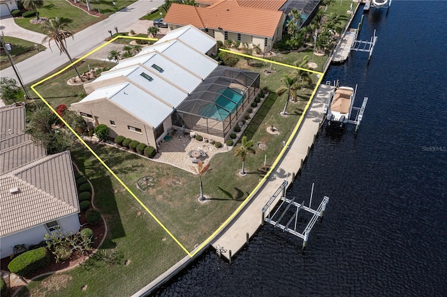 birds eye view of property featuring a water view