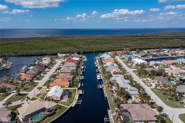 drone / aerial view with a water view