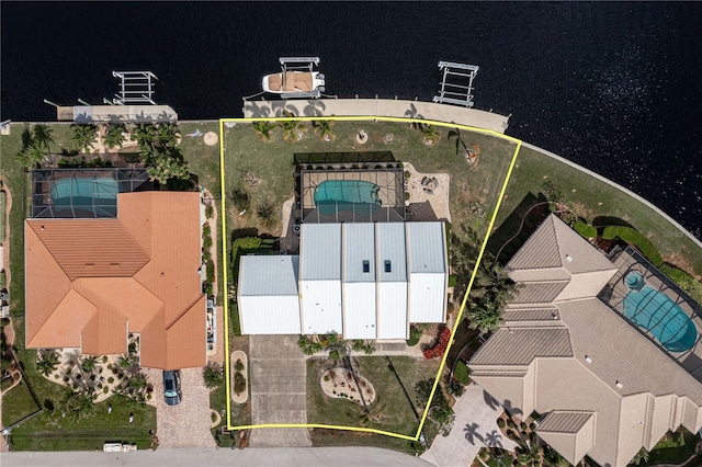 birds eye view of property with a water view