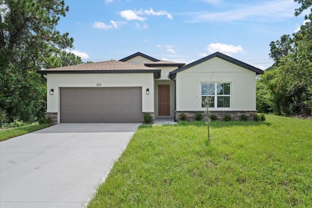 view of front facade featuring a front lawn and a garage