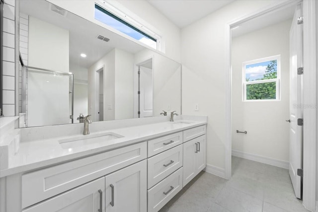 3390 Nadasky Ave, North Port, FL 34288 - full bath featuring double vanity, baseboards, and tile patterned floors