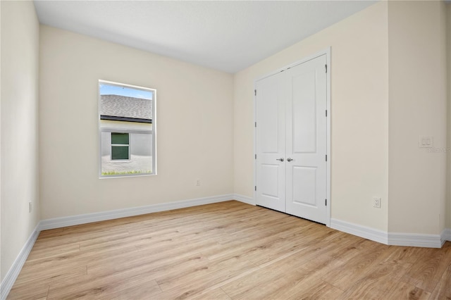 3390 Nadasky Ave, North Port, FL 34288 - unfurnished bedroom featuring wood finished floors, baseboards, and a closet