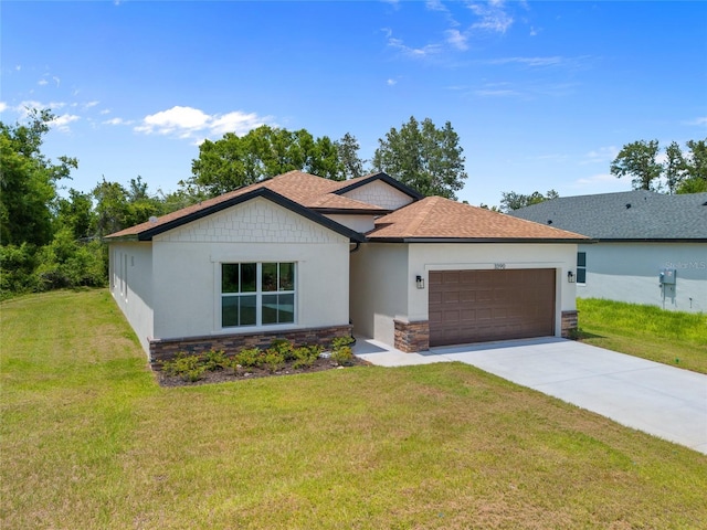 3390 Nadasky Ave, North Port, FL 34288 - single story home with stone siding, an attached garage, concrete driveway, stucco siding, and a front yard