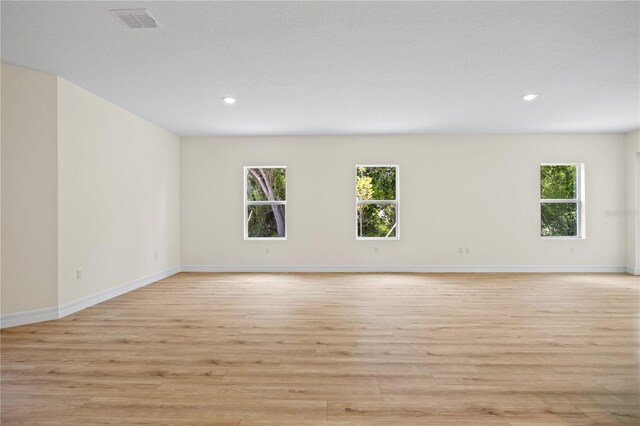 3390 Nadasky Ave, North Port, FL 34288 - unfurnished room with light wood-style flooring, plenty of natural light, baseboards, and recessed lighting