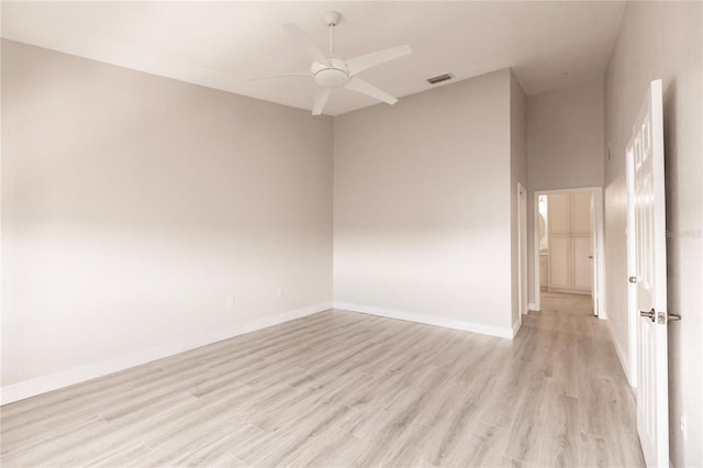 empty room featuring light hardwood / wood-style flooring and ceiling fan