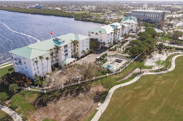 birds eye view of property with a water view