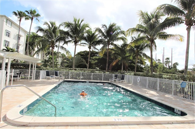 view of swimming pool with a patio