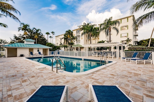 view of pool featuring a patio and a pergola