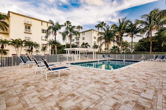 view of swimming pool with a patio area