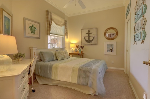 carpeted bedroom featuring crown molding and ceiling fan