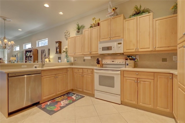 kitchen with light brown cabinets, ornamental molding, a notable chandelier, pendant lighting, and white appliances