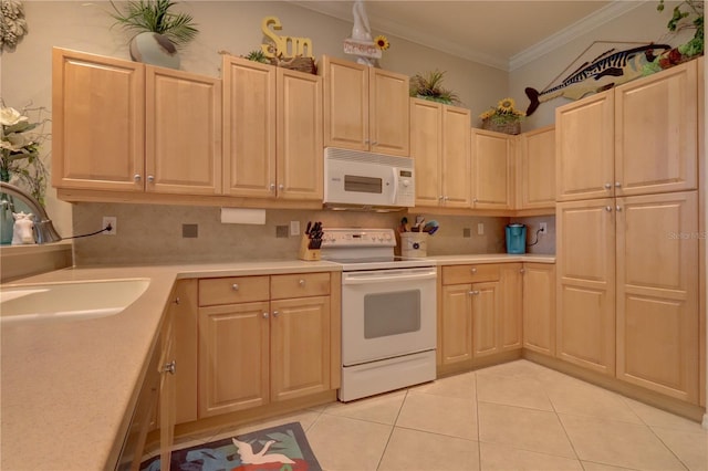 kitchen featuring sink, crown molding, light tile patterned floors, light brown cabinetry, and white appliances