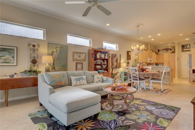 living room featuring ornamental molding, ceiling fan with notable chandelier, and light tile patterned floors