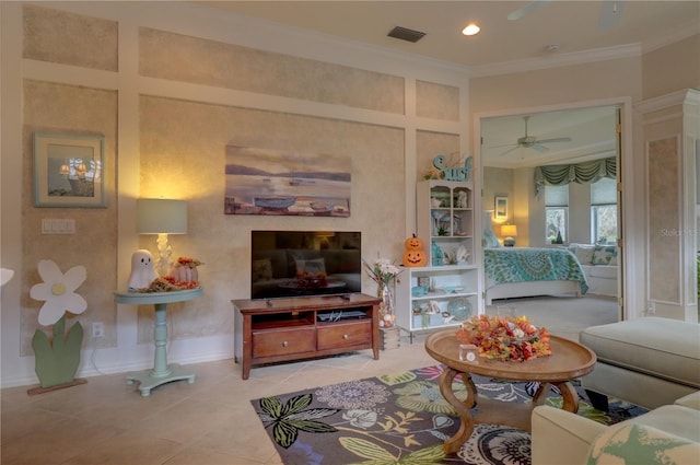 living room with ornamental molding, light tile patterned flooring, and ceiling fan