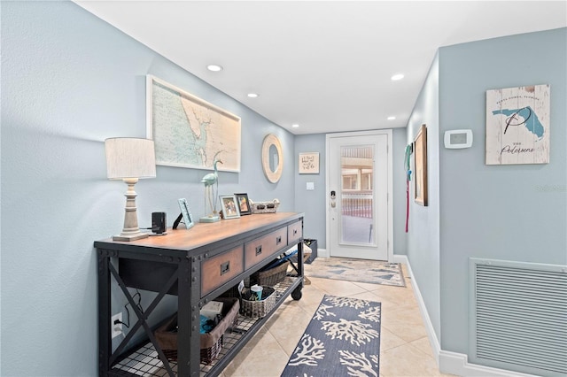 hall with light tile patterned flooring