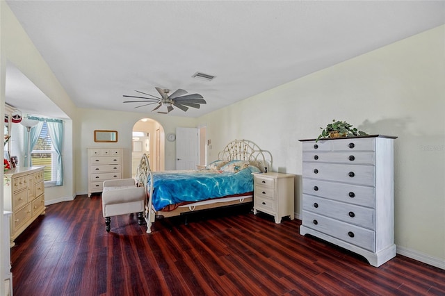 bedroom with ceiling fan and dark hardwood / wood-style floors