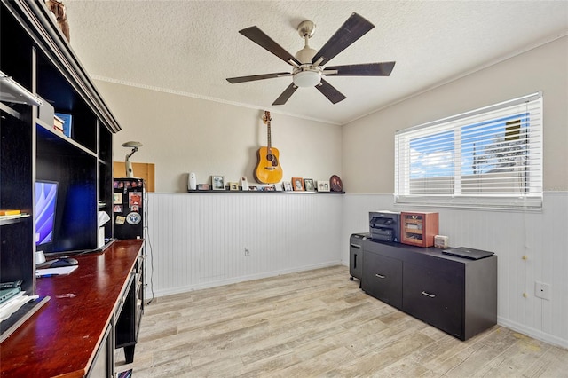 office area with light hardwood / wood-style floors, ceiling fan, a textured ceiling, and crown molding