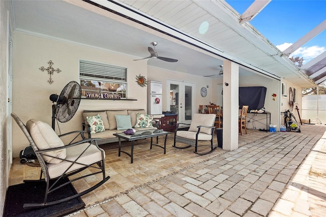 view of patio featuring ceiling fan, french doors, and an outdoor living space