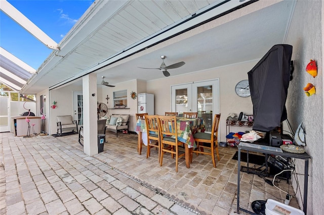 view of patio featuring ceiling fan and french doors