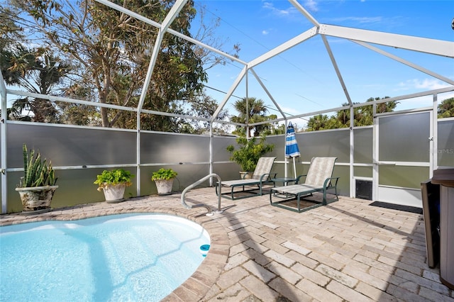 view of pool featuring a lanai and a patio area