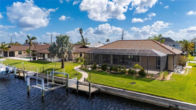 2736 Magdalina Dr, Punta Gorda, FL 33950 - back of property featuring a tiled roof, boat lift, a water view, and a lawn