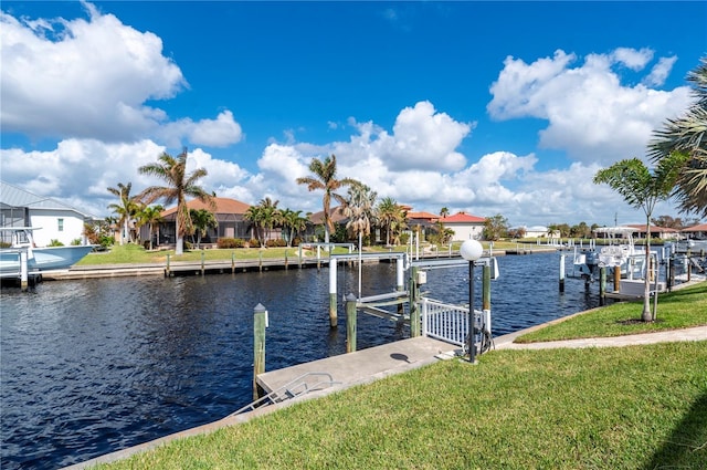 2736 Magdalina Dr, Punta Gorda, FL 33950 - dock area with a yard, boat lift, a residential view, and a water view