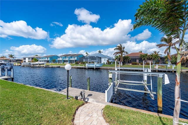 2736 Magdalina Dr, Punta Gorda, FL 33950 - dock area featuring a yard, boat lift, a residential view, and a water view
