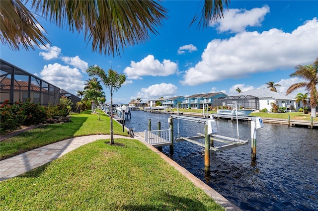2736 Magdalina Dr, Punta Gorda, FL 33950 - dock area featuring a residential view, boat lift, a water view, and a yard
