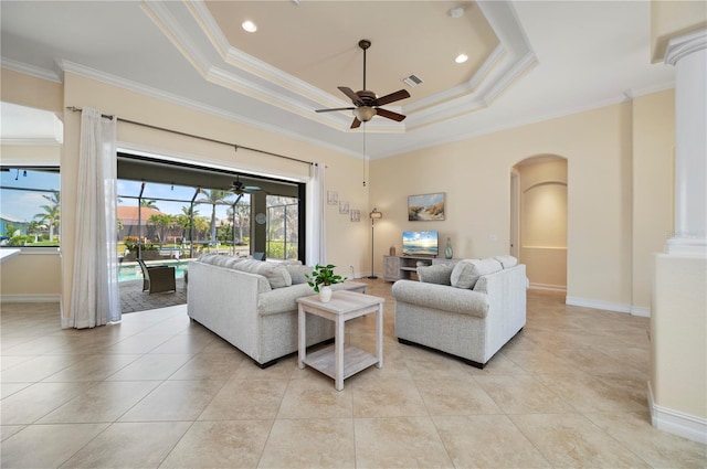 2736 Magdalina Dr, Punta Gorda, FL 33950 - living area featuring ceiling fan, arched walkways, a tray ceiling, visible vents, and ornamental molding