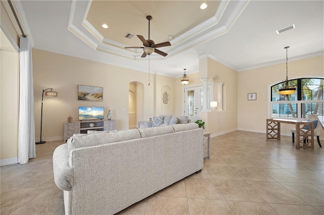 2736 Magdalina Dr, Punta Gorda, FL 33950 - living room with a ceiling fan, a tray ceiling, light tile patterned flooring, and visible vents