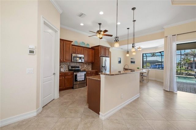 2736 Magdalina Dr, Punta Gorda, FL 33950 - kitchen with crown molding, stainless steel appliances, brown cabinets, and visible vents