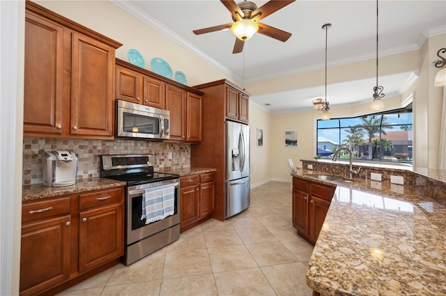 2736 Magdalina Dr, Punta Gorda, FL 33950 - kitchen with crown molding, a sink, brown cabinetry, stainless steel appliances, and tasteful backsplash