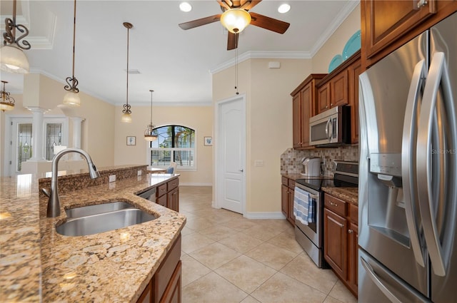 2736 Magdalina Dr, Punta Gorda, FL 33950 - kitchen with brown cabinetry, ceiling fan, tasteful backsplash, a sink, and stainless steel appliances