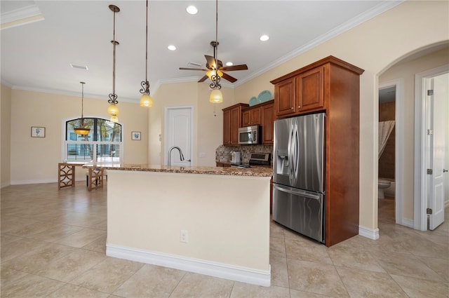2736 Magdalina Dr, Punta Gorda, FL 33950 - kitchen with a ceiling fan, appliances with stainless steel finishes, arched walkways, light stone countertops, and light tile patterned floors