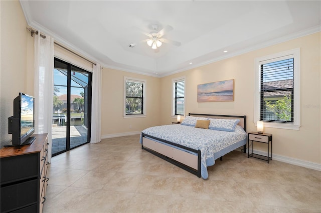 2736 Magdalina Dr, Punta Gorda, FL 33950 - bedroom with a tray ceiling, baseboards, access to outside, and multiple windows