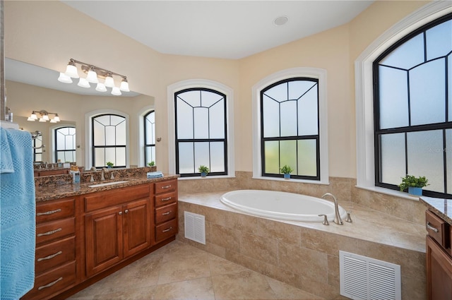 2736 Magdalina Dr, Punta Gorda, FL 33950 - full bath featuring vanity, a garden tub, and visible vents