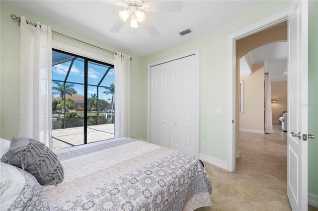 2736 Magdalina Dr, Punta Gorda, FL 33950 - bedroom with light tile patterned flooring, access to outside, arched walkways, visible vents, and a closet